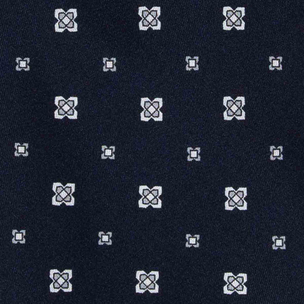 dark blue and white patterned silk tie