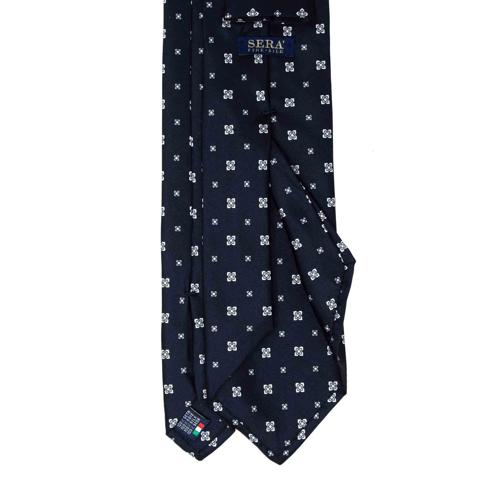 dark blue and white patterned silk tie