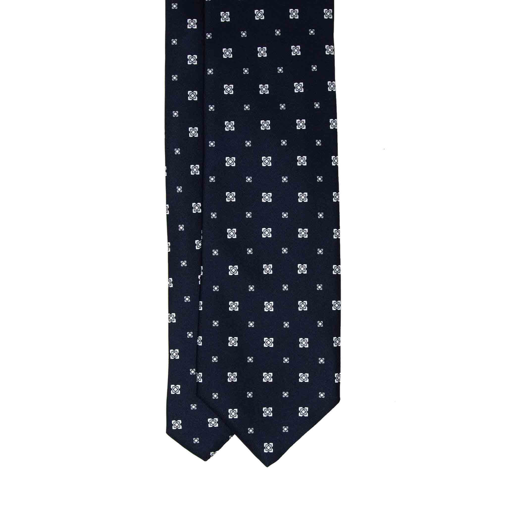 dark blue and white patterned silk tie